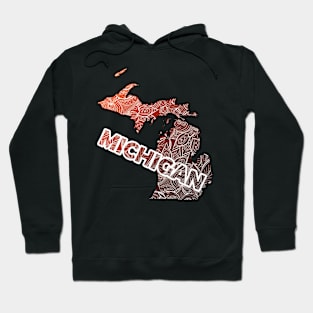 Colorful mandala art map of Michigan with text in brown and orange Hoodie